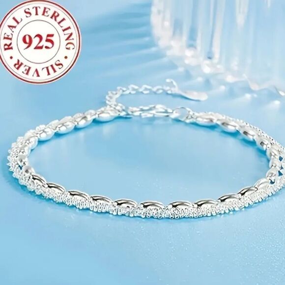 Elegant 925 sterling silver charm bracelet. - Picture 1 of 9